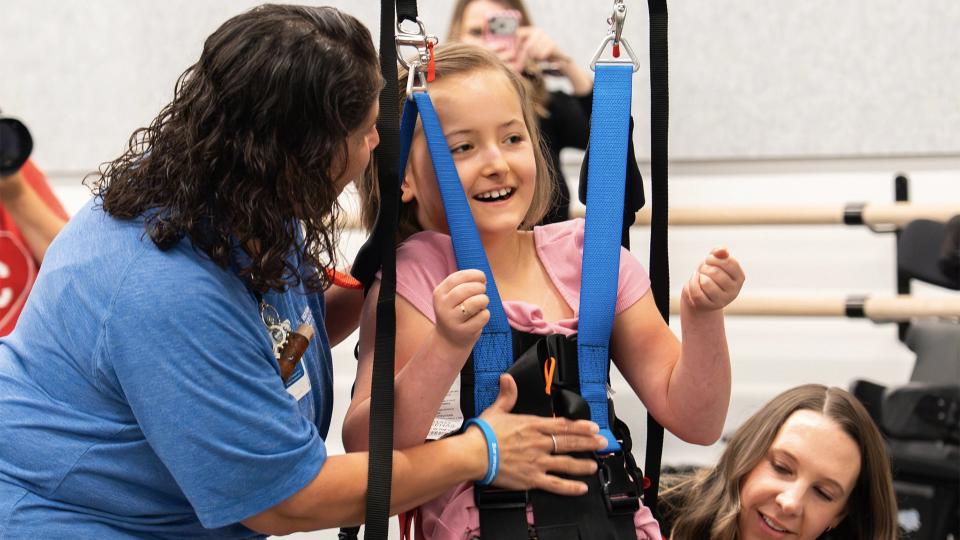 Student trying on a harness with our new adaptive harness system